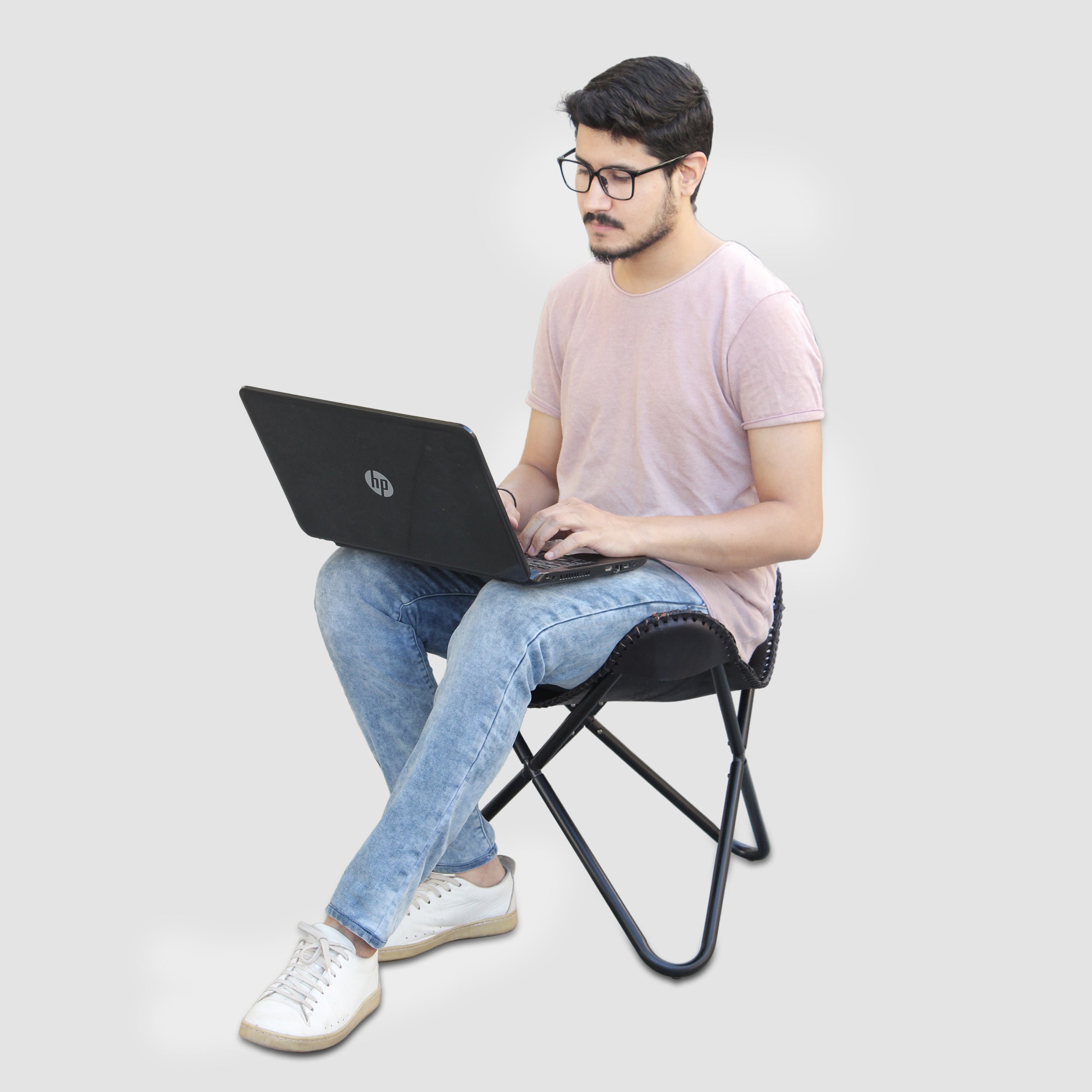 Model Sitting on Genuine Leather Black Foot Stool