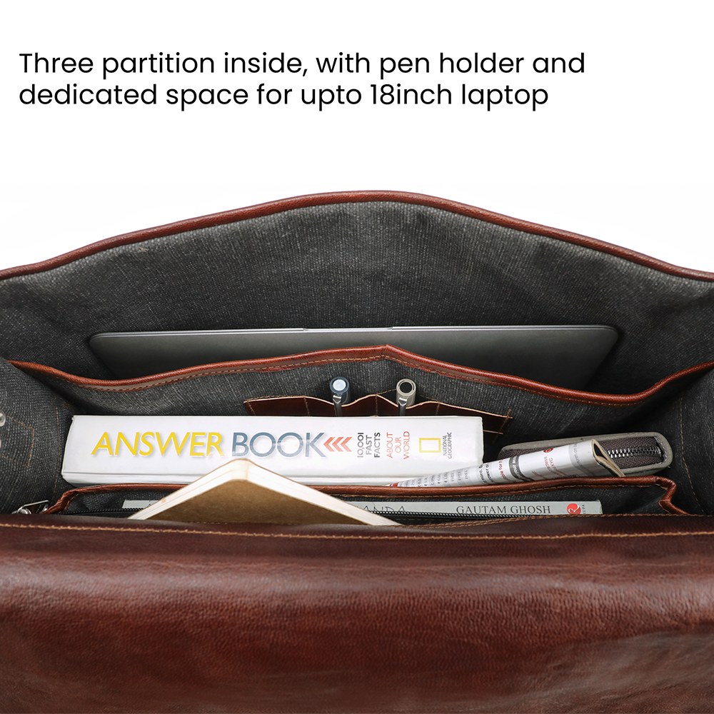 Inside of the black leather bag for men showing dedicated laptop compartment, pen slots, and spacious compartment for books or documents