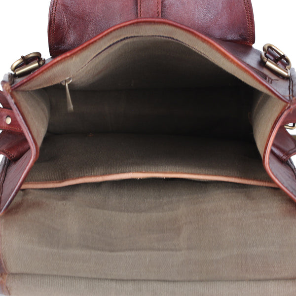 Interior part of the backpack from top view showing spacious compartment and laptop sleeve with Inner zipper pocket