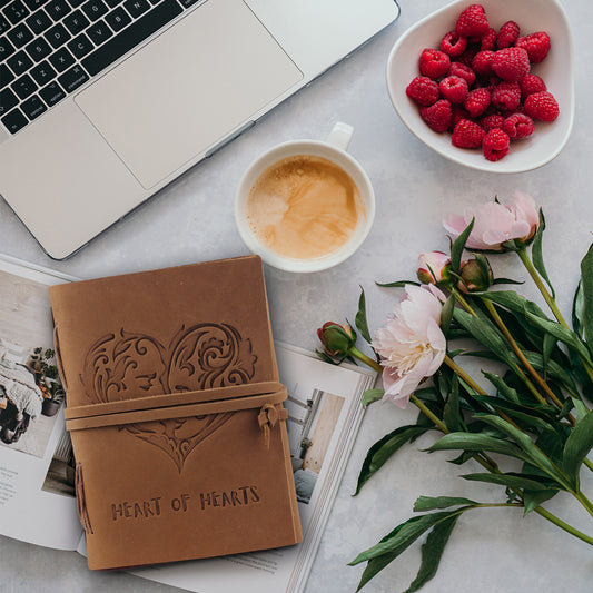 Leather Textnote By Handmade World Lying on table with laptop, flowers, coffee and berries in a bowl.